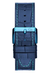 Tamsiai mėlyna odinė laikrodžio apyrankė su krokodilo raštu, mėlynos spalvos siūlėmis ir blizgiu mėlynu metaliniu sagtimi, turinčiu logotipą.
