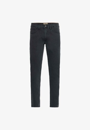 Mustat farkut, joissa tiukka leikkaus, viiden taskun malli ja napillinen kiinnitys. Sileä pinta ja hienovarainen haalistuma kankaassa.