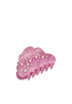 Pink plastic hair claw with a wavy design, adorned with small white pearls and gold studs. Features several interlocking teeth for grip.