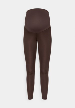 Brązowe legginsy ciążowe z wysokim elastycznym pasem i gładką teksturą, zaprojektowane z myślą o komforcie i wsparciu podczas ciąży.