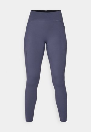 Høytaljede leggings i en ensfarget mørkegrå farge. Laget av elastisk stoff med flatlocksømmer og en figurtilpasset, avsmalnet bendesign.