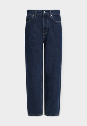 Σκούρο μπλε τζιν με ίσιο μπατζάκι, ψηλή μέση, ασημί εξαρτήματα, μπροστινές τσέπες και λεπτομέρειες ραφής. Κλασικός σχεδιασμός με πέντε τσέπες.