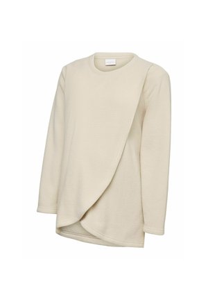 Cream-colored long-sleeve fleece top with round neckline and asymmetrical layered front panel.