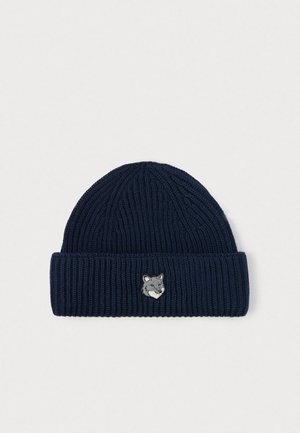 Navy blue ribbed knit beanie with a folded cuff featuring a small embroidered gray fox head on the front center.