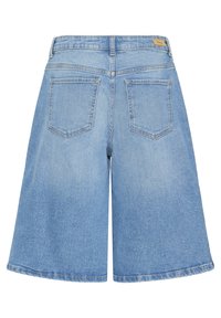 Sinised teksashõlmad, laia säärega disain, keskmise tõusuga vöökoht, kaks tagataskut, narmendav ääreosa. Sile tekstuur peente tuhmunud detailidega.