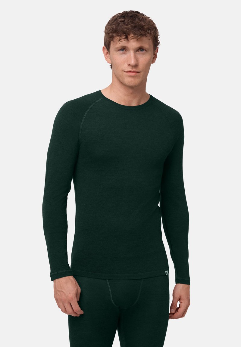 Thermisch shirt met lange mouwen in donkergroen, gemaakt van zachte stof. Heeft een ronde halslijn en een aangesloten pasvorm met geribbelde accenten op de mouwen.