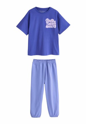 Purple short-sleeve top with "Good Times Ahead" text paired with light purple elastic-waist pants, forming a matching casual loungewear set.