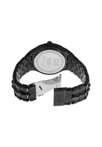 Montre noire en métal avec un bracelet maillé, boîtier rond et fermoir en argent. Le dos affiche "DIESEL VERT", conçue pour la durabilité et le style.