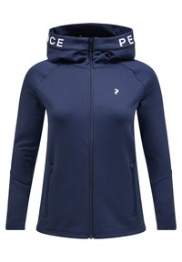 Mørkeblå zip-up hættetrøje med høj krave, der præsenterer et hvidt logo på hætten, frontlapper med lynlås og en glat stofftekstur.