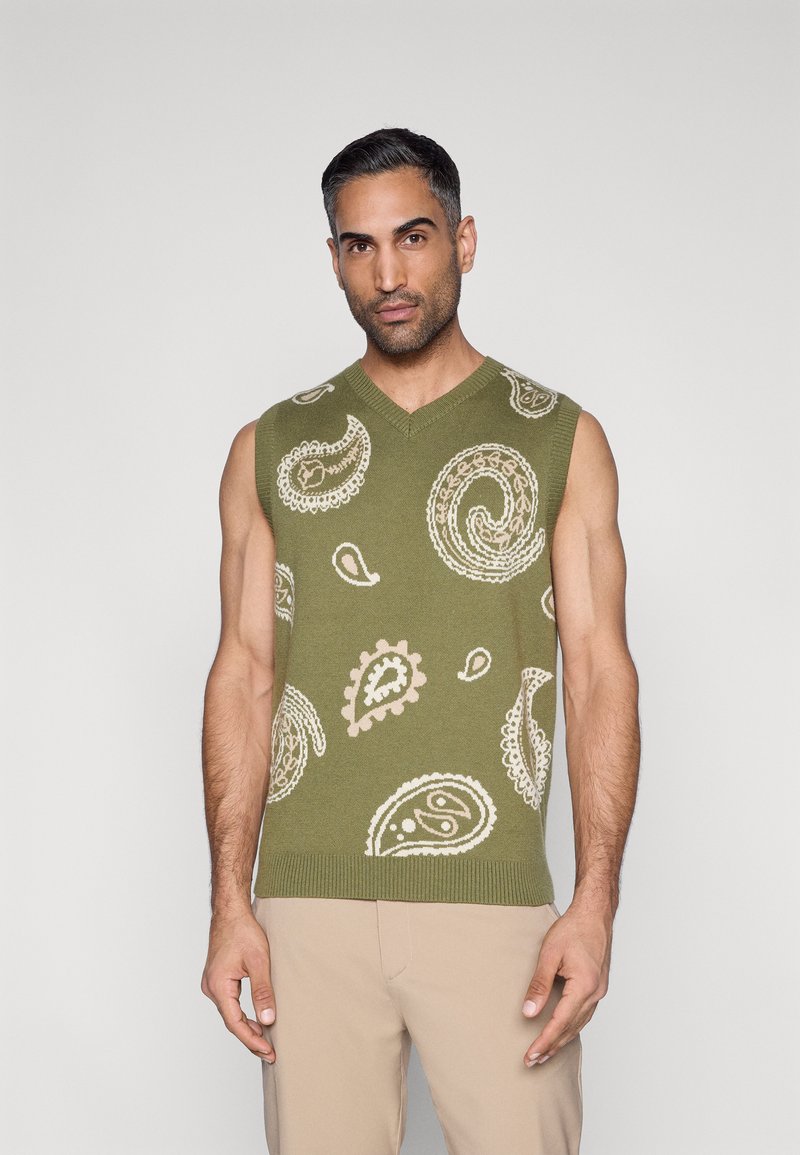 Žalias rankovių megztinis su paisley raštu smėlio spalvos. V formos iškirptė, su ribbingo krašto apdaila, megzta faktūra ir vidutinio storio medžiaga.