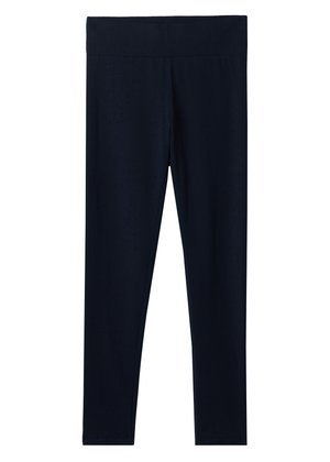 Leggings negros de cintura alta y longitud completa con una banda ancha en la cintura, hechos de un tejido liso y elástico.