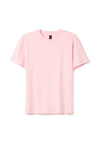 Camiseta de algodón rosa con cuello redondo, mangas cortas y un ajuste relajado. Textura suave, sin estampados ni elementos metálicos visibles.