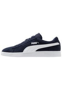 Navy suede sneaker with white accents, featuring a flat rubber sole, lace-up closure, and prominent Puma logo on the side and heel.