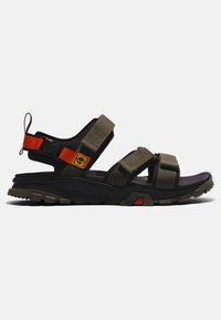 Olive green sport sandals with adjustable straps in textured fabric, black sole, and durable grip. Features bright orange accent and logo.