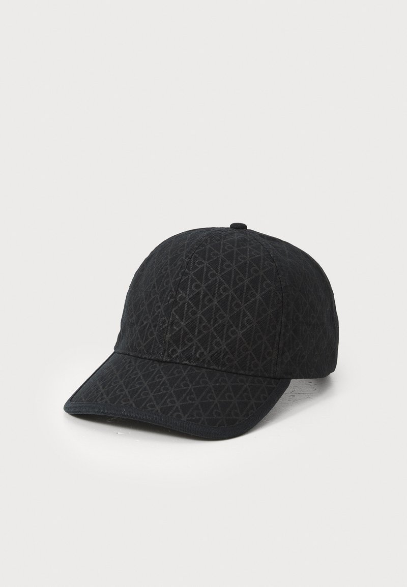 Black cap featuring a textured pattern of interlocking diamonds, curved brim, and a button on top. Made from soft fabric.