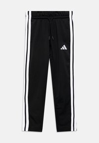 Juodos sportinės kelnės su baltomis šoninėmis juostelėmis, elastinga juosmens juosta, raištelis ir balta adidas logotipas viršutinėje kairėje kojoje. Sklandaus paviršiaus audinys.