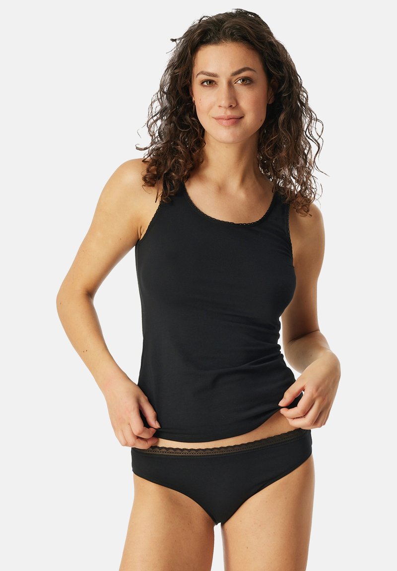 Débardeur noir avec bordure en dentelle et sous-vêtements assortis en noir. Tissu doux, design ajusté et bords sans coutures pour un confort et un bon ajustement.