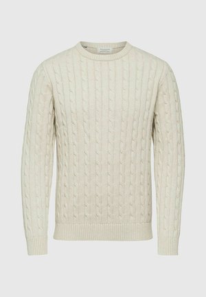 Maglione lavorato a maglia beige chiaro con un motivo a treccia, scollatura rotonda e polsini e orlo a coste, realizzato in un morbido tessuto.