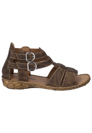 Brown leather sandal with multiple straps and silver hardware, featuring a textured sole and open toe design for ventilation.