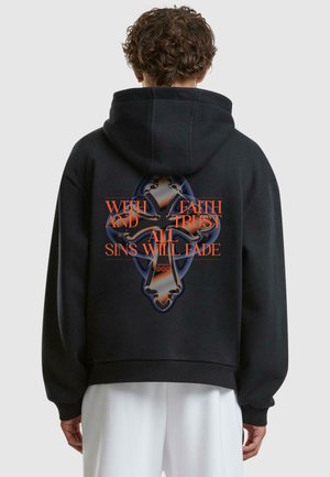 Black hoodie with a large graphic on the back, featuring an ornate cross design and text: "WITH FAITH AND TRUST ALL SINS WILL FADE."