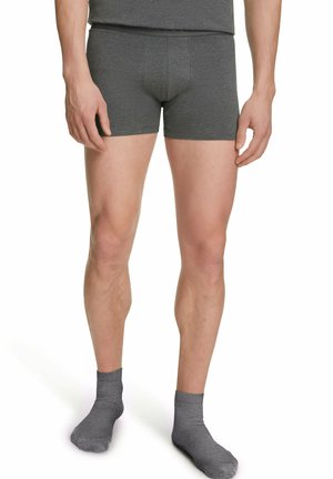 Gray cotton boxer shorts with a fitted design and elastic waistband, paired with gray ankle socks. Material appears smooth and stretchy.