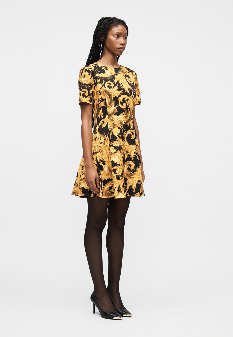 gold dress black tights BETHANY HOURGLASS ROMPER DRESS