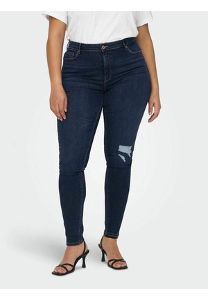 Dark blue skinny jeans with a high waist, featuring a ripped detail on the left knee. Made of denim with a smooth texture.