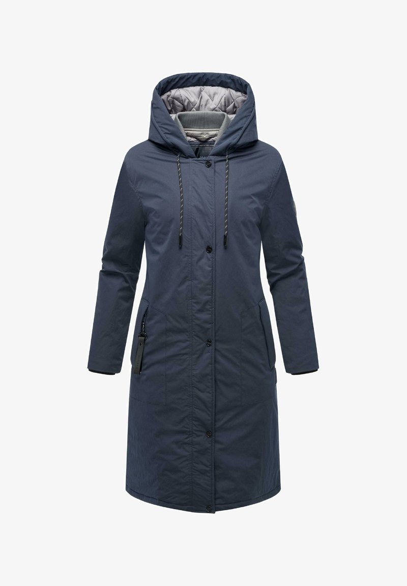 Jūrinės tamsiai mėlynos spalvos ilgas paltas su kapišonu, pagamintas iš vandeniui atsparaus audinio. Yra užtrauktuku uždaroma kišenė, reguliuojamos raištelės ir mygtukų užsegimas.