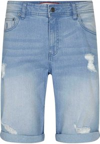 Vaaleansiniset farkkushortsit, joissa on käännetyt helmapeitteet ja kulutettuja reikiä etushaarukoilla ja vasemmassa taskussa.