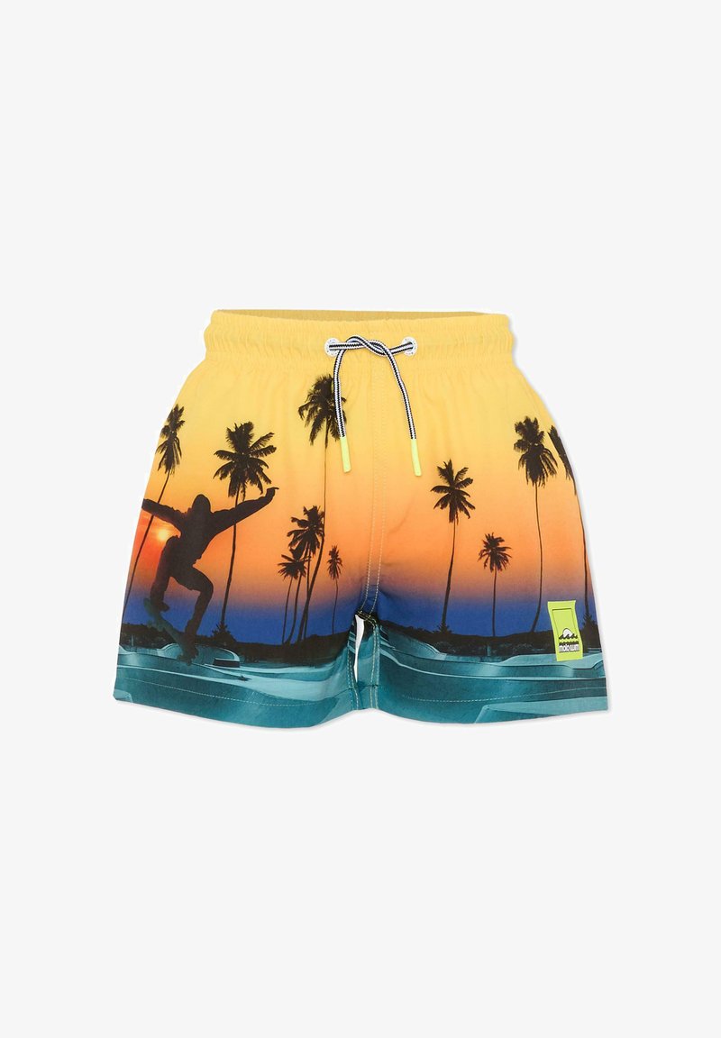Żółte kąpielówki z czarnym nadrukiem palmy i deskorolkarza, z tłem w gradientowym zachodzie słońca i zielonymi akcentami. Zawierają elastyczny pas.