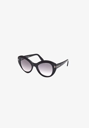 Zwarte plastic zonnebril met een oversized cat-eye vorm, gradient lenzen en goudkleurige accenten op de pootjes. Logo zichtbaar binnen het montuur.