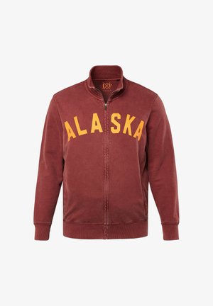 Bordeauxfarbene Zip-Jacke mit hohem Kragen, mit "ALASKA" in gelben Buchstaben auf der Brust; aus weichem Stoff mit glatter Textur gefertigt.
