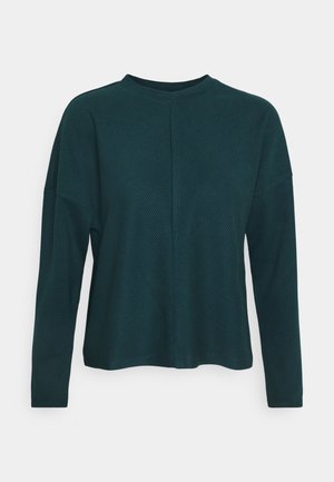 Tmavě zelený dlouhý rukáv top s texturovaným, žebrovaným vzorem, s kulatým výstřihem a kleslými rameny. Uvolněný střih.