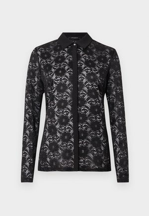 Black lace blouse with a collared neckline, long sleeves, floral pattern, and button details along the front. Textured, semi-sheer fabric.