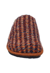 Chausson en laine présentant un motif à carreaux orange, violet et gris. Bout arrondi, doublure en feutre orange et semelle noire pour l'adhérence.