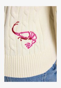 Unselected, embroidered cream