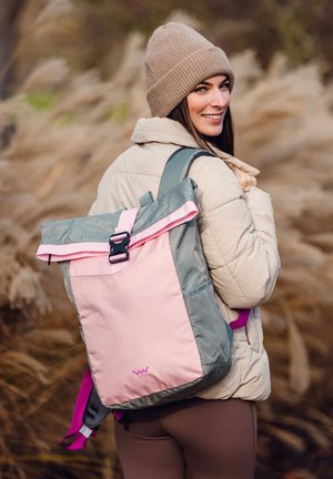 Multicolored roll-top backpack in pink and gray fabric with adjustable straps, a black buckle, and a logo at the bottom. Textured surface.
