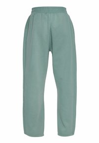 Pantalon de survêtement vert clair coupe décontractée avec taille élastique et poches latérales, adapté pour une tenue décontractée.