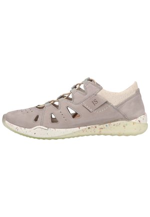 Light gray footwear featuring a soft suede upper, open side cutouts, elastic laces, and a textured, speckled white sole.