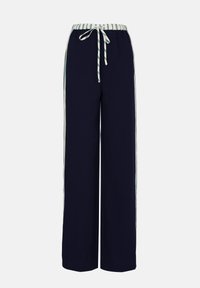 Marinefarbene, weit geschnittene Hose aus weichem Stoff, mit einem gestreiften Bund und passendem Kordelzug, sowie weißen und grünen seitlichen Streifen.