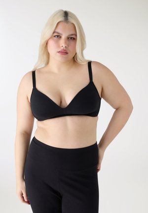 - Biustonosz z trójkątną miseczką