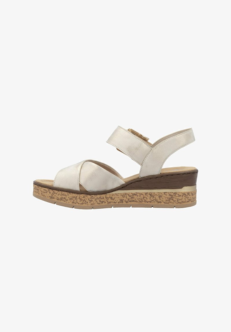 Wedge sandal with a light beige synthetic upper, crossed straps, adjustable buckle, and a textured cork sole. Flat heel accent.