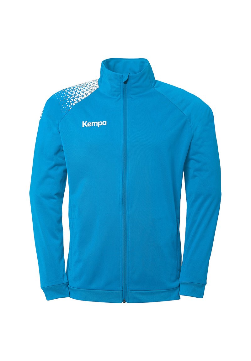 Blå træningsjakke lavet af glat stof, med høj krave, hel længde lynlås og geometrisk mønster på skulderen.