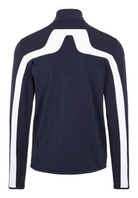 Bluza din material elastic, cu mânecă lungă, de culoare bleumarin, cu guler înalt și dungi albe diagonale pe umeri și mâneci.