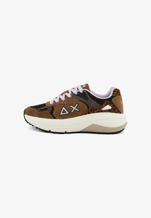 Brown suede sneakers with black accents, pink laces, and a textured rubber sole. Features a leopard print detail on the heel.