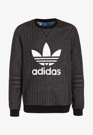 Sweat-shirt Adidas motif chevrons noir et gris avec logo Trèfle blanc et texte sur le devant, poignets et col côtelés.