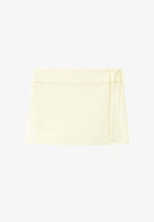 Mini omslagsnederdel i cremefarvet med tynde sidesnøringer og et glat, minimalistisk design.