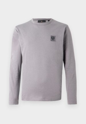 Gray long-sleeve t-shirt in soft cotton. Features a round neckline and a small dark label patch on the chest. Smooth texture, casual design.