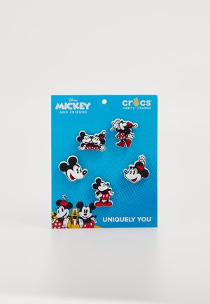 Charms Jibbitz Disney sur fond bleu représentant cinq personnages : Mickey Mouse et Minnie Mouse en noir, rouge et blanc avec différentes poses et expressions.
