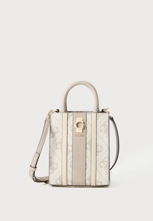 Compact beige and cream Guess handbag with a top handle, detachable shoulder strap, and gold logo plaque on patterned fabric.
